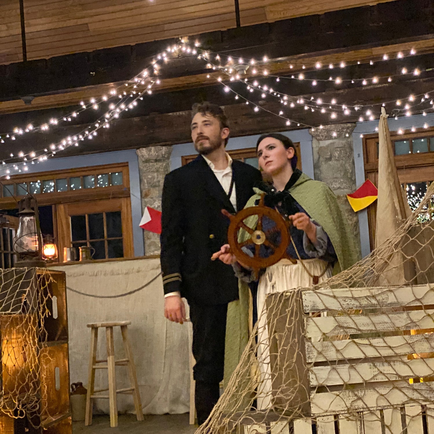 Valkyrie's Sea Fever characters in a rustic setting with string lights and a wooden steering wheel.